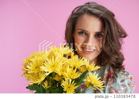 happy modern woman in floral dress on pink 110383478