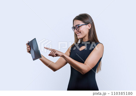 Young business woman with digital tablet on white background 110385180