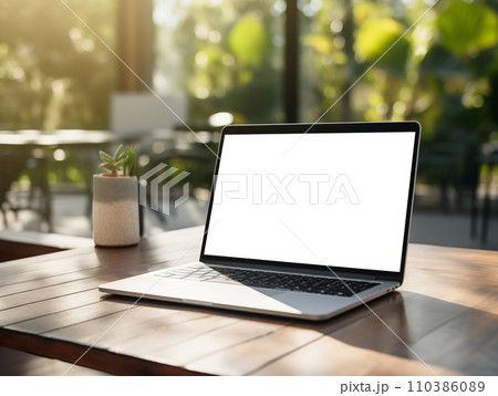 AI-generated content. Laptop screen mockup, white isolated empty computer screen, open laptop standing on table with tropical green plants 110386089