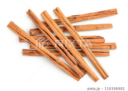 Cinnamon sticks isolated on white background with full depth of field. Top view. Flat lay. 110386982