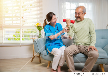 Asian nurse physiotherapist helping senior man in lifting dumbell at retirement home, Young nurse take care support training elderly sitting on sofa using dumbbell workout exercise, Healthcare medical Asian nurse physiotherapist helping senior man in lifting dumbell at retirement home, Young nurse take care support training elderly sitting on sofa using dumbbell workout exercise, Healthcare medical 110388543