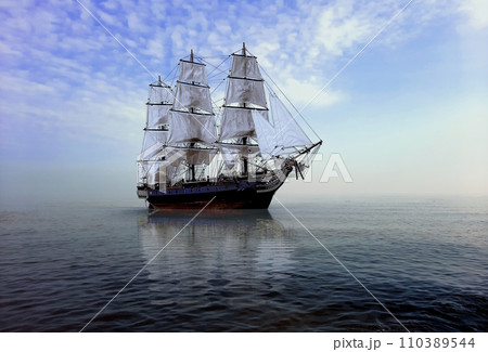 18th Century ship on calm sea water under cloudy blue sky 110389544