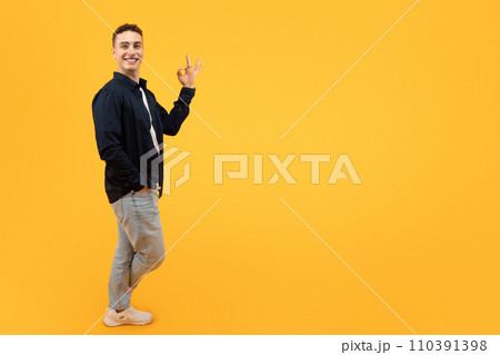 Cool young guy showing okay gesture, copy space Cool young guy showing okay gesture, copy space 110391398