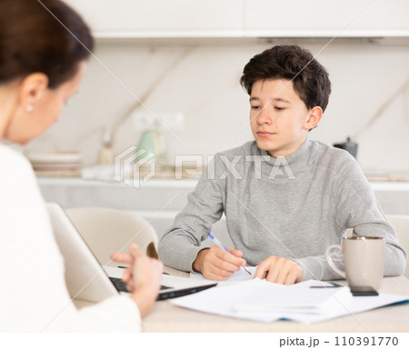 Boy studying with tutor 110391770