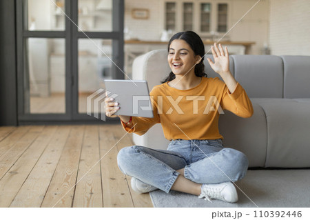 Happy Indian Woman With Digital Tablet Making Video Call At Home 110392446