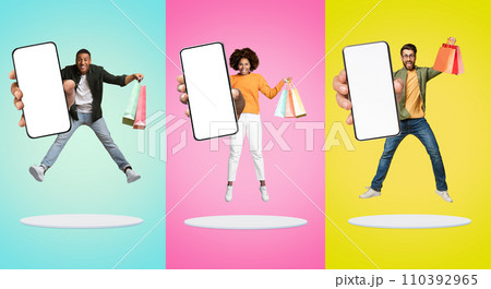 Online Sales. Happy People Jumping With Shopping Bags And Big Blank Smartphone In Hand 110392965