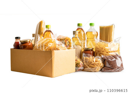 Foodstuff for donation isolated on white background with clipping path, storage and delivery. Various food, pasta, cooking oil and canned food in cardboard box. Foodstuff for donation isolated on white background with clipping path, storage and delivery. Various food, pasta, cooking oil and canned food in cardboard box. 110396615