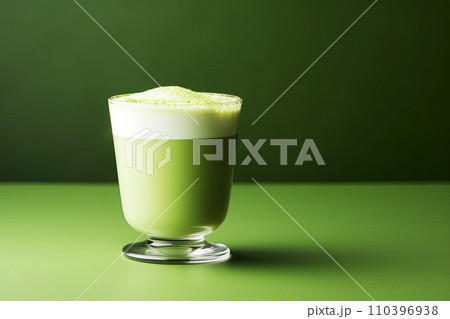 Matcha latte in a glass cup, green background 110396938