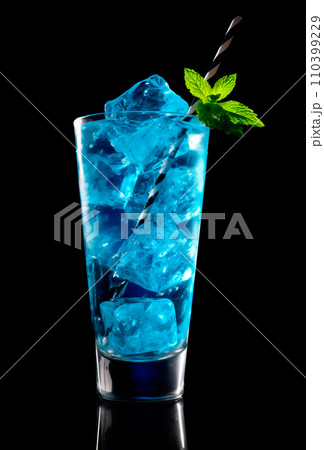 Blue Curacao cocktail garnished with a lime isolated on black background 110399229
