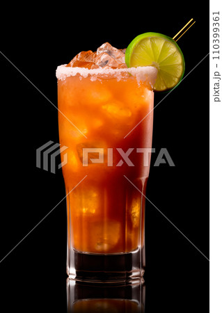 Michelada cocktail in beer glass featuring with beer, lime juice, tomato juice, spicy sauce and spices on black. Michelada cocktail in beer glass featuring with beer, lime juice, tomato juice, spicy sauce and spices on black. 110399361
