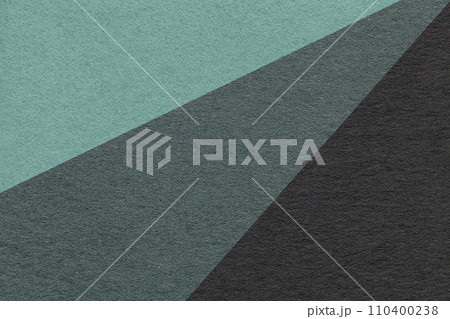 Texture of old craft cyan, teal and black color paper background, macro. Vintage abstract cardboard Texture of old craft cyan, teal and black color paper background, macro. Vintage abstract cardboard 110400238