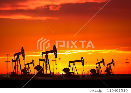 Oil drill rig and drilling derrick. Crude oil Pumpjack on oilfield on sunset Oil drill rig and drilling derrick. Crude oil Pumpjack on oilfield on sunset 110401510