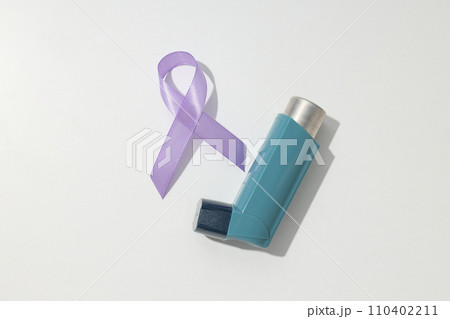 Epilepsy day concept, inhaler with lavender ribbon 110402211