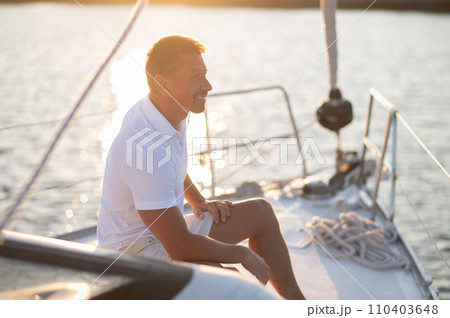 Well-built man in white tshirt on the yacht 110403648
