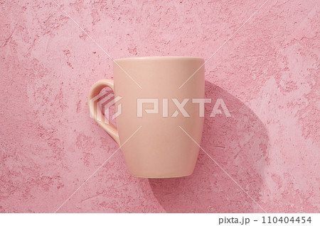 A beautiful cup on a pink background 110404454