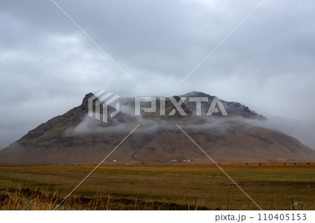 Autumn foggy country and a mountain, South Iceland 110405153