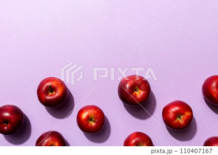 Many red apples on colored background, top view. Autumn pattern with fresh apple above view 110407167