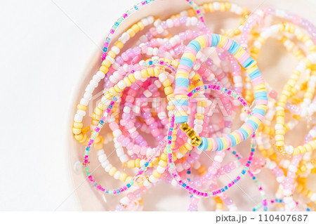 Little girl's charming bracelets adorned with clay and sea beads. Little girl's charming bracelets adorned with clay and sea beads. 110407687