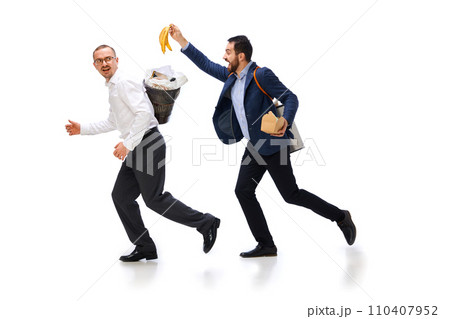 Sorting garbage types. Two men with trash bins on backs cleaning, taking care after planet, gathering garbage over white background Sorting garbage types. Two men with trash bins on backs cleaning, taking care after planet, gathering garbage over white background 110407952