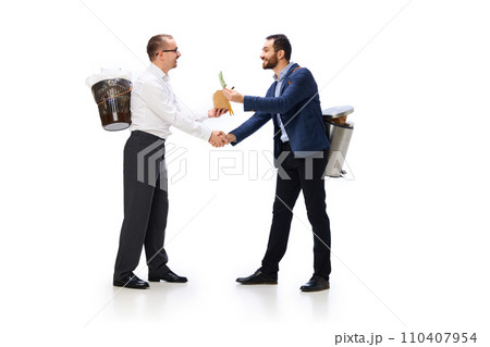 Two mem holding trash bins on backs, shaking hands, cleaning garbage isolated over white background 110407954