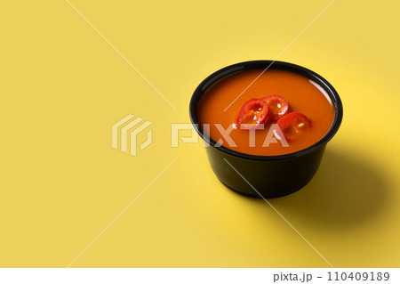 Spicy chili sauce in a bowl on yellow background Spicy chili sauce in a bowl on yellow background 110409189