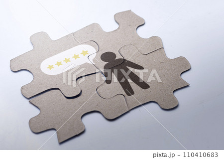 Jigsaw puzzle with the human figure and five-star rating Jigsaw puzzle with the human figure and five-star rating 110410683