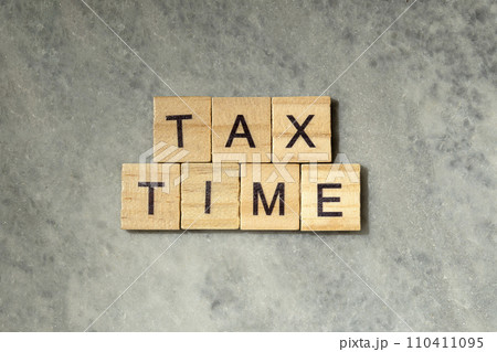 Wooden cubes with TAX TIME letters 110411095