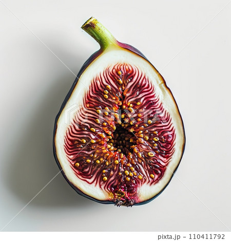 Half of a purple fig isolated on white background 110411792