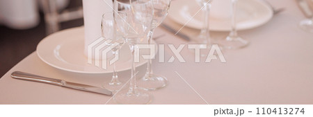 Three empty glasses for alcoholic beverages of vodka, wine and champagne are on the table Three empty glasses for alcoholic beverages of vodka, wine and champagne are on the table 110413274
