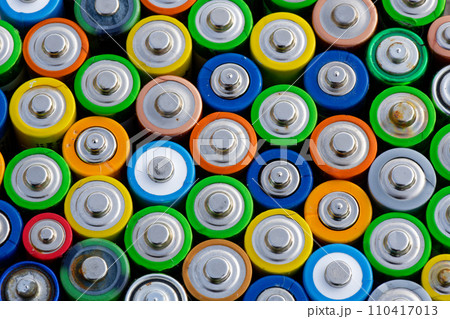 Old used batteries. Batteries background Old used batteries. Batteries background 110417013