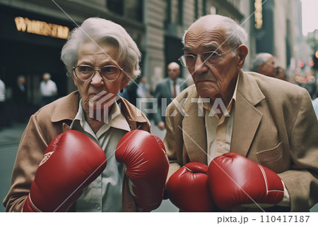 Pensioners boxing on street in USA. Grandmother boxing with grandfather.  110417187