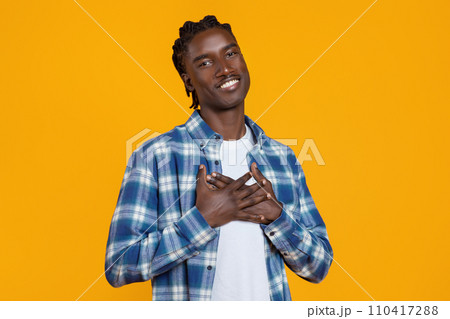 Gratitude Concept. Thankful African American Guy Keeping Both Palms On Chest Gratitude Concept. Thankful African American Guy Keeping Both Palms On Chest 110417288