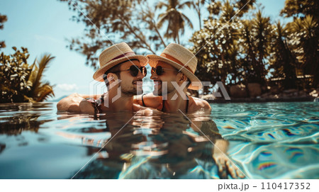 Gay couple relaxing in swimming pool. 110417352