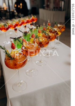 Welcome drink with cocktail glasses and drinks at an event. Alcoholic beverages at a wedding 110417736