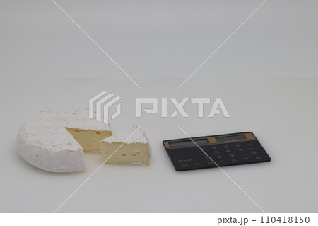 piece of cheese on a white background. Weight loss, diet and weight control. Still life with healthy food. Healthy food. The concept of a healthy lifestyle. Weight control. 110418150