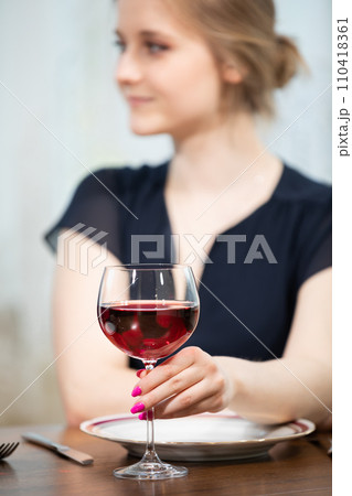 A ladies' night out with a glass of wine. 110418361