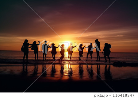 Bitch barty. Silhouette of group of people at sunset on beach party.  110419547