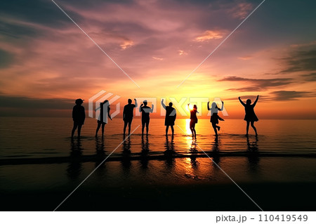 Bitch barty. Silhouette of group of people at sunset on beach party.  110419549