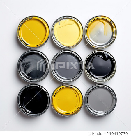 Jars with yellow, black and gray paint on a white background. Cans with yellow, grey and black paint , top view. 9 cans of professional paint for stylish repairs. Jars with yellow, black and gray paint on a white background. Cans with yellow, grey and black paint , top view. 9 cans of professional paint for stylish repairs. 110419770