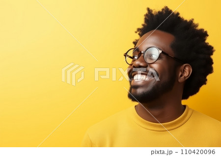 Handsome african american man wearing glasses on yellow background. 110420096