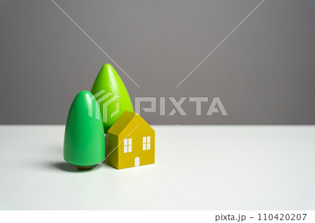 House with trees. Buying a nice house. Garden work, landscape design. Figurine 110420207