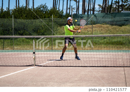 Tennis player performing a drop shot Tennis player performing a drop shot 110421577