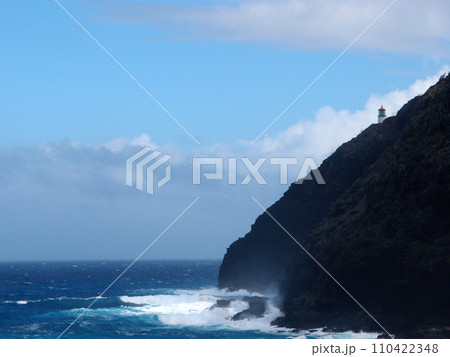 Makapu'u Lighthouse on cliffside as wave crashing into rocks below Makapu'u Lighthouse on cliffside as wave crashing into rocks below 110422348