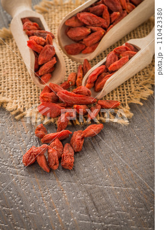 Goji berries on a wooden spoons 110423380