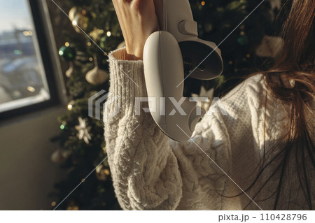 An energetic young girl was gifted a virtual reality headset for Christmas. An energetic young girl was gifted a virtual reality headset for Christmas. 110428796