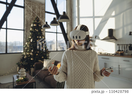 Expressing her thoughts, the lovely young lady in a virtual reality headset speaks about her experiences. Expressing her thoughts, the lovely young lady in a virtual reality headset speaks about her experiences. 110428798