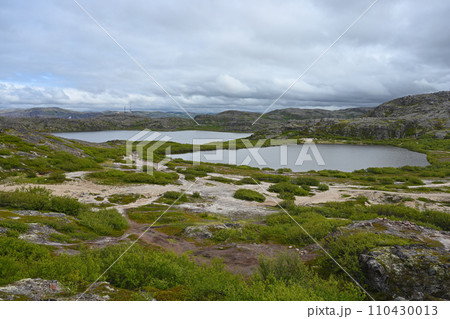 Northern landscape with a lakes and tundra surrounded by hills on the Kola Peninsula 110430013