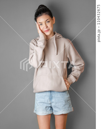 Portrait of a young pretty girl in a  hoodie 110432675