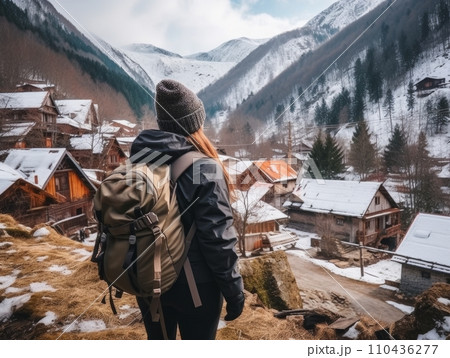 AI-generated content. Girl with a tourist backpack in the mountains in winter. AI 110436277