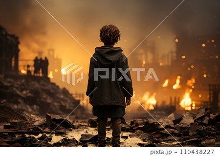 A boy in a war-torn country stands sad-faced in...のイラスト素材 [110438227 ...